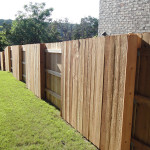 Alternating wooden fence sections