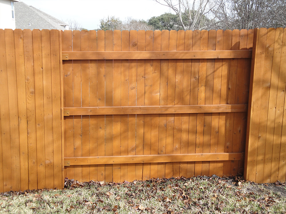 Alternating section red wooden fence