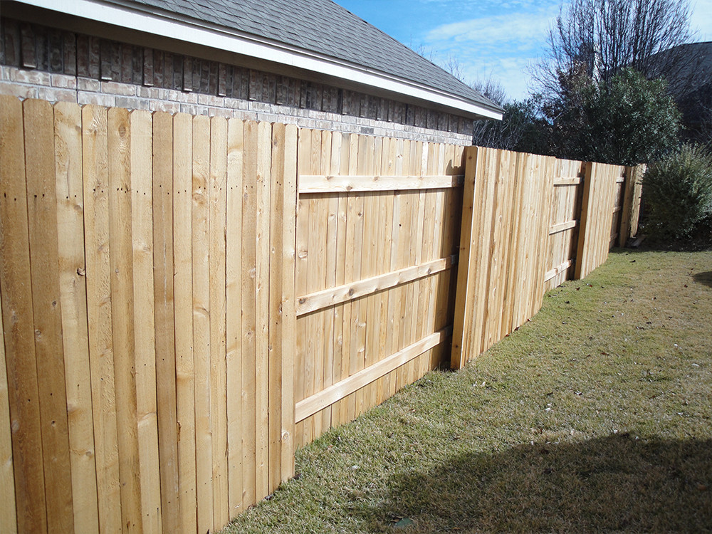 Wood fence with alternating sections