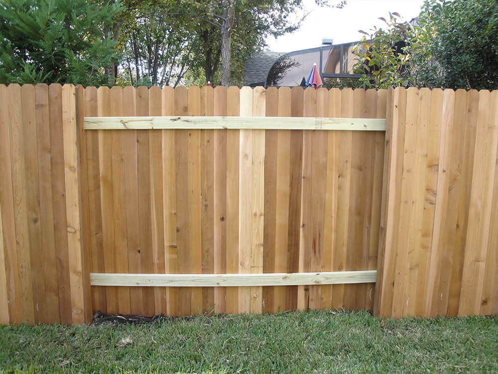 Wood fence with white vertical planks