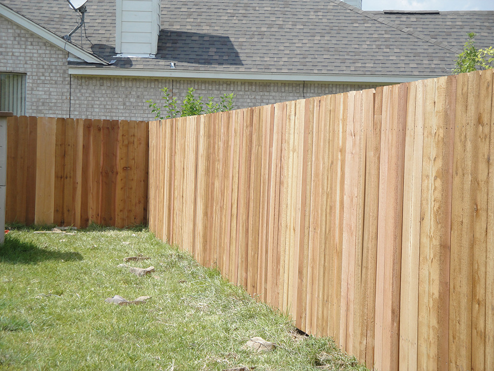 Wooden fence in the corner of a yard