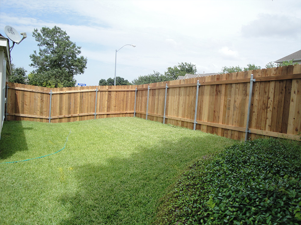 backward wooden fence with steel posts