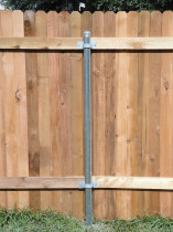 Steel post on a wooden fence
